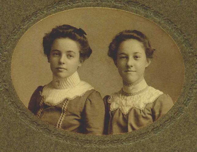 Sepia toned portrait of sisters circa 1900