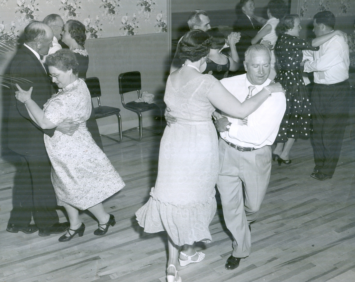 black and white photo of couples dancing
