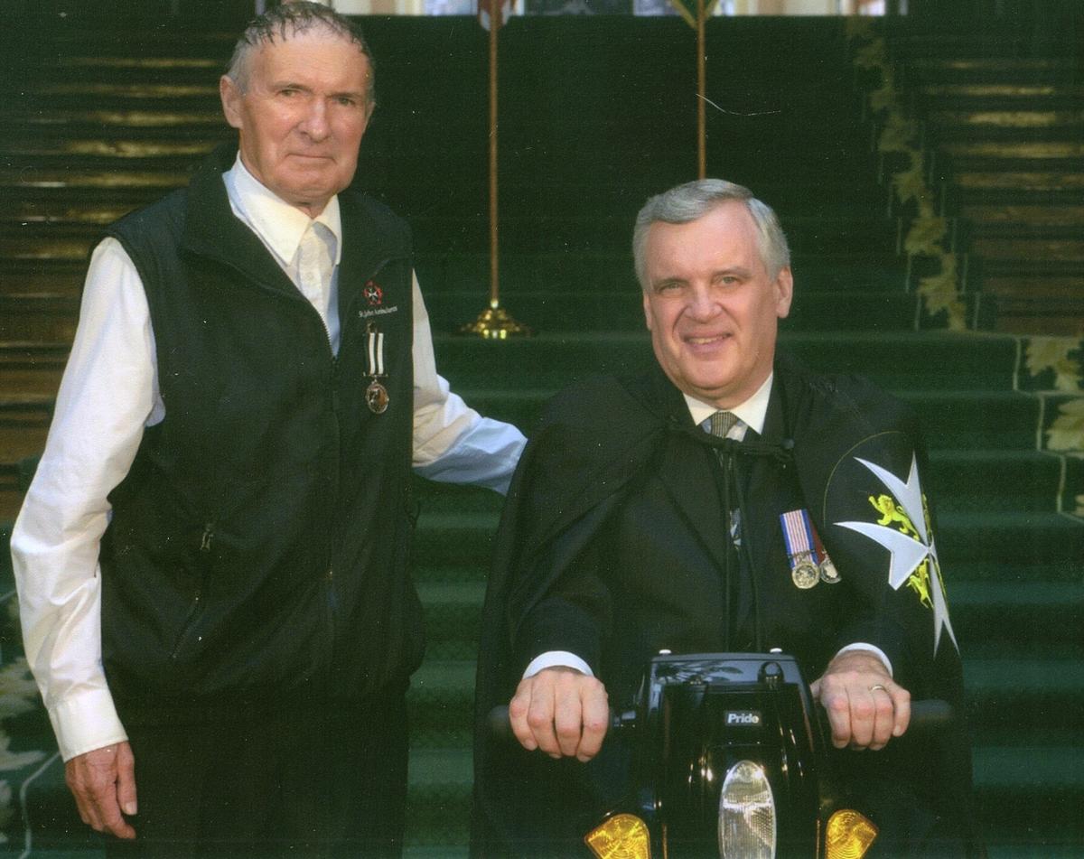 two older men in st. john ambulance uniforms